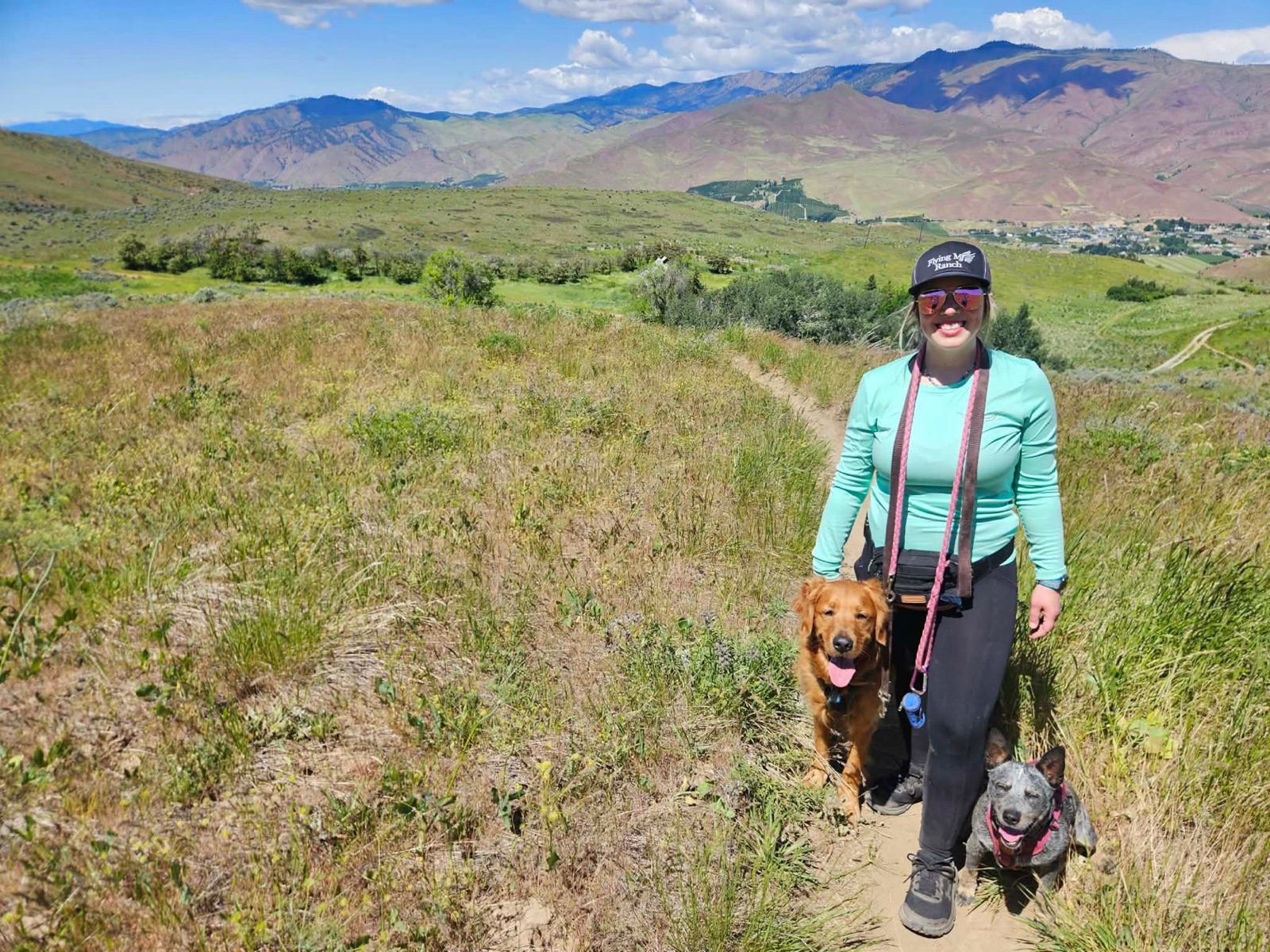 Sabrina Fitzgerald hiking through the Wenatchee Valley with two of her dogs.